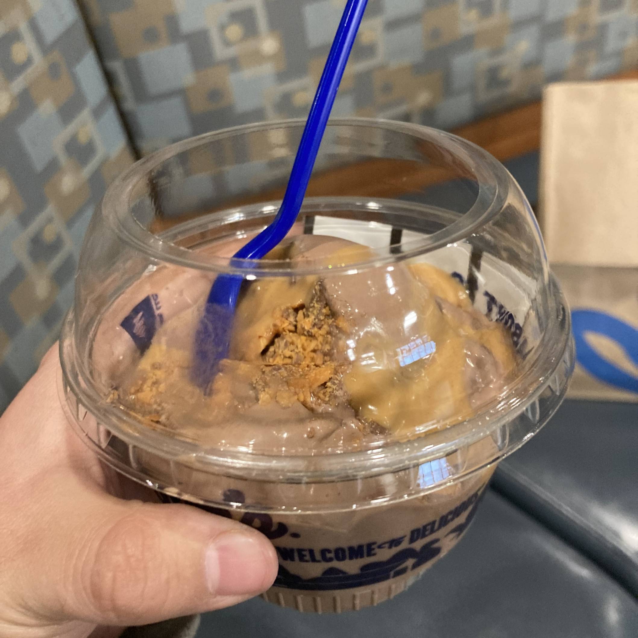 Me holding up my frozen custard.