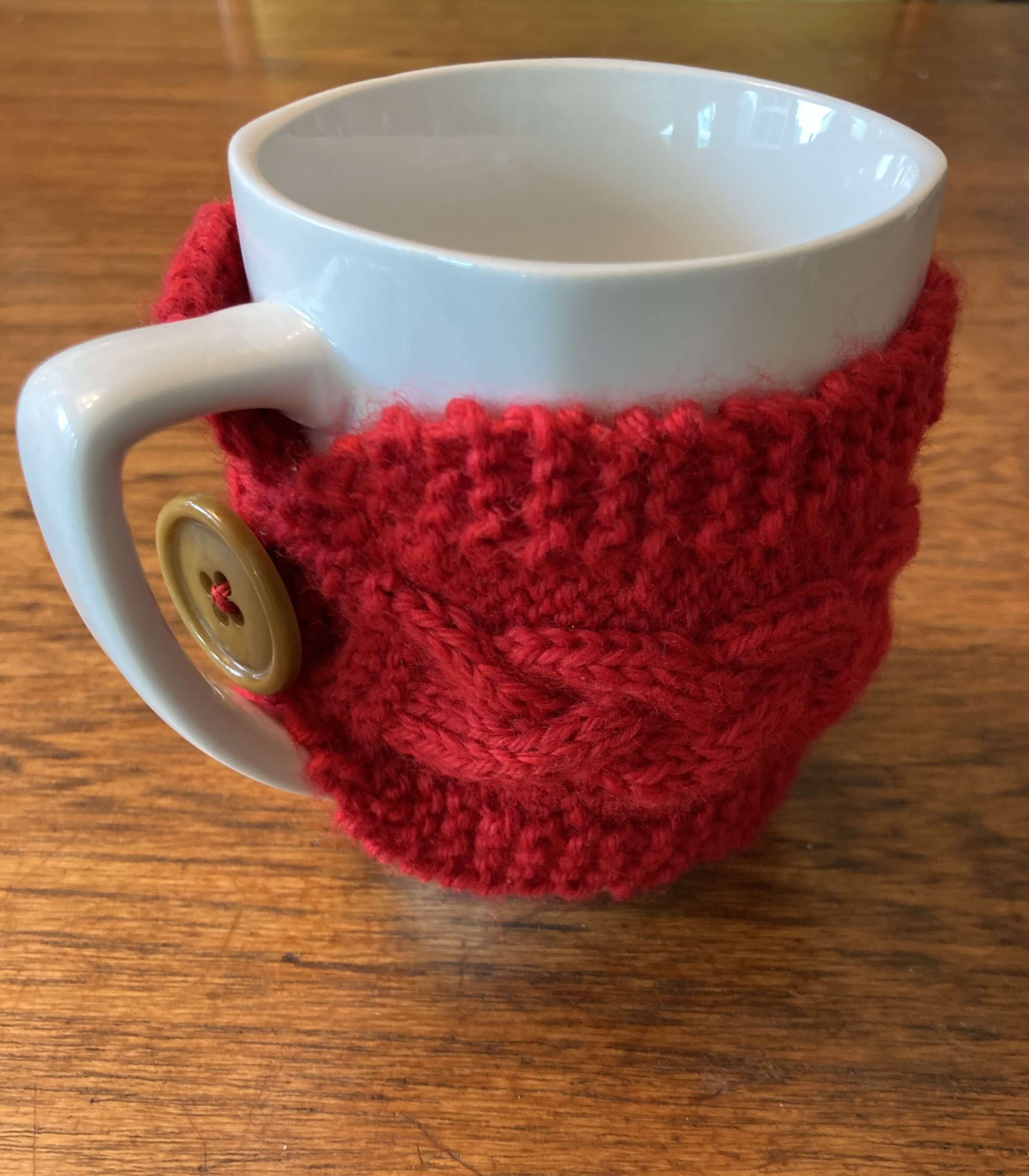 The mug cozy wrapped around a mug (right side view).